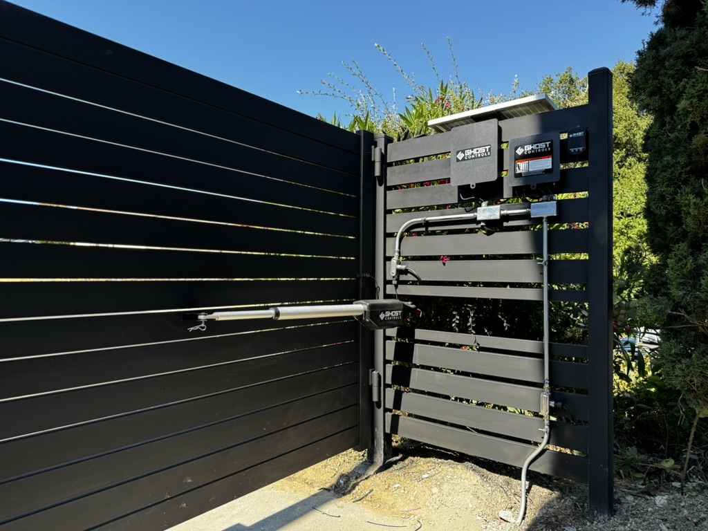 GXP technician working on an automatic gate