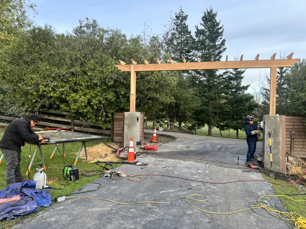 GXP technician working on an automatic gate